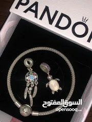  3 PANDORA bracelet, for sale, plus two charms as a gift. price for all 60 dinars