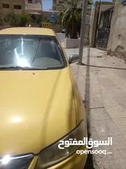  2 تكسي نيسان صني طبعة زرقاء للبيع