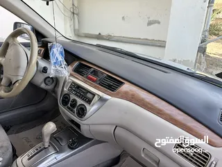  9 ‎متسبويشي لانسر موديل 2004 اتوماتيك ماتور 1600