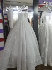  25 محل بدلات وفساتين عرايس