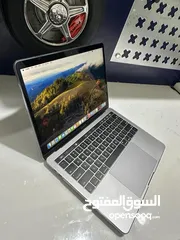  1 macbook pro with touch bar