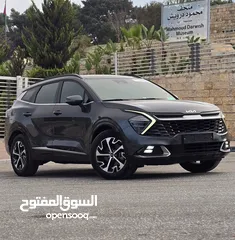  1 كيا سبورتاج هايبرد 2023 / فل كامل مع بانوراما وفرش مميز غرفه عسليه / عداد قليل / سعررر مميز جداً