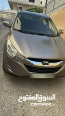  2 2009 ‏Hyundai توسان LX20 اربع ابواب، اللون فيراني، الكراسي جلد والسيارة 92,000 كيلو فقط وبحالة رائعة