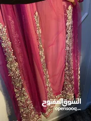  8 فستان زهري مطرز بالمسات طويل ويوجد حزام من نفس الموديل
