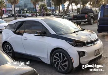  1 BMW i3 كهرباء بدون بنزين تيرا للبيع او بدل ع بكم حديث  ممكن البدل ع بكم عالي دوج او فورد 2015