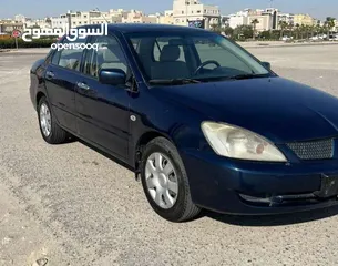  3 لانسر 2009 كحلي بحالة ممتازة