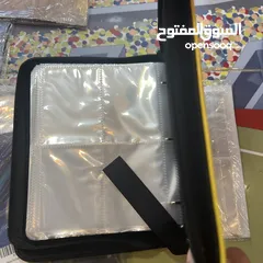  6 كروت بوكيمون والبومات (Pokemon cards and binders)