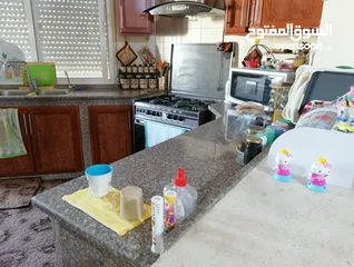  9 للبيع شقة طابق ارضي قرب دوار الدبابة مساحة 100+ترس وبلكونة