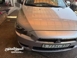  1 متسوبيشي لانسر 2012سيارة جديدة من ناحية مطور وجير وعلى الفحص