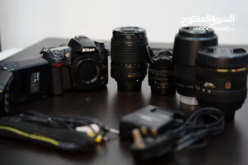  1 Nikon d7000 full gear body+4lenses+flash+ bag (exellent condition) price discount for fast sell