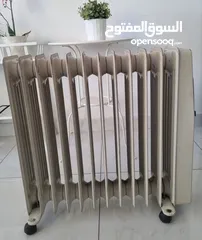  1 مدفأة زيت كهربائيه