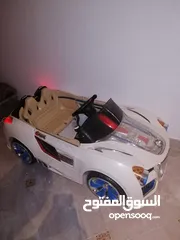  2 TOW SEATER KIDS CAR , RECHARGEABLE.