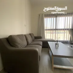  1 Comfy Sofa with a table