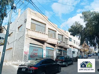  1 REF 83 تملك عمارة تجارية مميزة جدا في حي الحسين بمساحة 205م