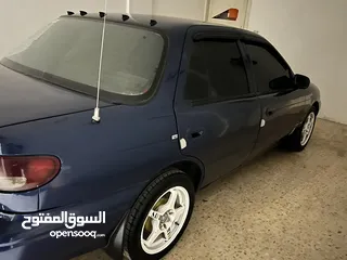 9 كيا سيفيا لون ازرق ميتالك نظيفه مع جنط 15 مميز كاوشوك وكاله غرفه نطيفه بطاريه جديده لسى كفالتها معها