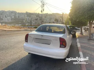  1 دايو لانوس موديل 2002 جير عادي سيارة مشالله ولا ضربة افحص وين بدك ترخيص تامين دفع فقط كاش