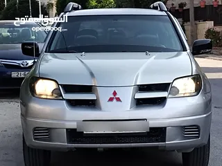  3 ميتسوبيشي آوتلاندر اوتوماتيك 2003 توب نظافة بسعرررر مميززز محرك 2400cc