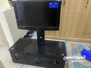  2 Sharp tv with table for sale