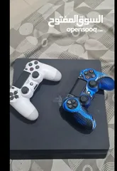  1 playstation 4 slim 500gb with 2 controllers and 7 games