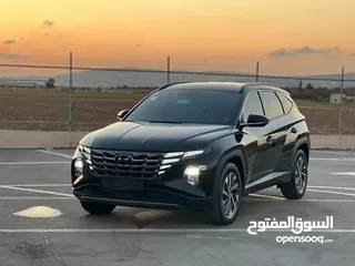  1 هونداي توسان/2022 فل الفل بدون فتحة سقف  2x4 ///240Hp بنزين + كهرباء  ( Haybrid) 1600cc