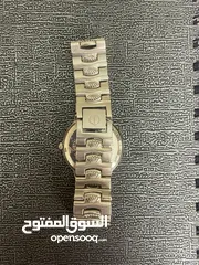  7 espec ساعة فضية كوارتز ستانلس ستيل ضد الماء صنع في الصين سير على شكل صدفات بحرية الداخل أسود
