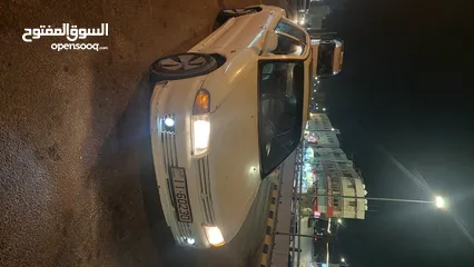  1 لانسر 93 جير عادي مرخصه سنه ماتور 1500cc انجكشن