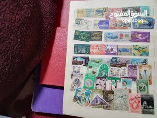 21 نيشان ملكى وزن41, 41 جرام من الدهب والفضه وعقدفضه من الاحجار الكريمه وطوابع قديمه نادره