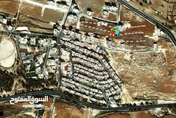  1 ارض من اراضي شمال عمان ياجوز واجهه على الشارع للبيع
