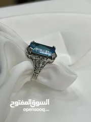  1 *خاتم فضة بحجر أكوامارين – عيار 925، وزن 5.4 جرام