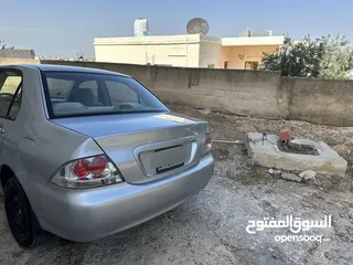  2 لانسر موديل 2004 ماتور 1600 فحص مرفق