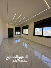  15 شقه طابق ارضي 144متر مع ترس 30 متر للبيع في جبيهه حي المنصور بموقع مميز