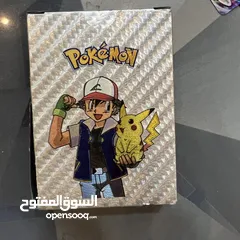  1 كروت بوكيمون والبومات (Pokemon cards and binders)