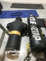  1 مجسم ملاكمة سيلكون مواصفات دوليه + كيس ملاكمة جلد ثقيل 180 سم +عجل شد عضلات المعدة والصدر