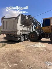  2 تعهدات عامة وهدم مباني ونقل جميع أنواع مواد البناء ونقل تراب أحمر وتعبيد الشوارع بأفضل أنواع الخلطة