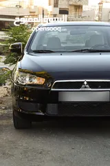 18 ميتسوبيشي لانسر 2016 ممشى 59 الف كيلو فحص كامل سبعة جيد ولا ملاحظة