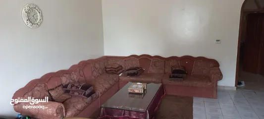  3 sofas and a table