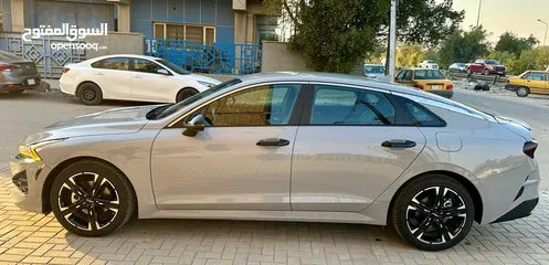  9 kia k5 gt line 2024 وارد امريكي للبيع حره بغداد اللون سمنتي