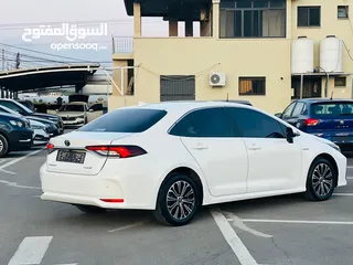  9 تيوتا كورولا هايبرد ترخيص 2022 فل بدون فتحة مميزة  ماتور 1800cc ( بنزين + كهرباء) 170Hp