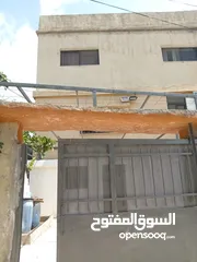  2 منزل كامل للبيع في جرش منطقة الجبارات مطل على شارعين قريب من مطعم وسوبر ماركت الوادي الأخضر