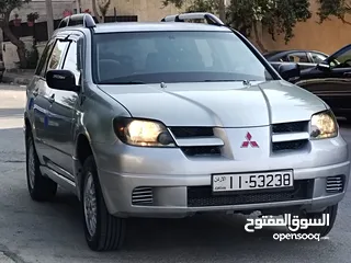  2 ميتسوبيشي آوتلاندر اوتوماتيك 2003 توب نظافة بسعرررر مميززز محرك 2400cc