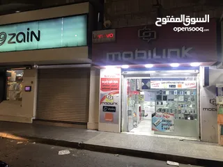  11 محل تجاري للبيع مجهز كامل موقع مميز ملاصق لمعرض شركة زين - شارع باب الواد - الوسط التجاري/ الزرقاء