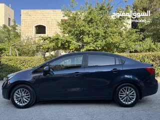  4 كيا ريو 2014 متور 1250 بنزين جير عادي فحص ممتاز  لون كحلي فرش بيج تحكم ستيرنج