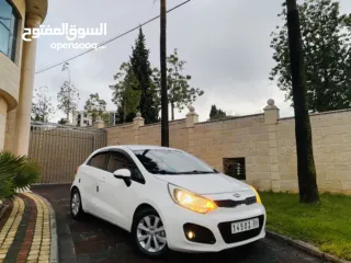  2 كيا برايد 2015 بحالة الوكالة فل اوتماتك ترخيص وتإمين جديد الله يبارك ..