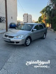  7 ميتسوبيشي لانسر فحص كامل 1600اصلي ولا ملاحظه موديل 2009 اوتوماتيك بوضع الشركه وارد الكويت مالك واحد