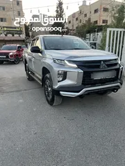  22 ميتسوبيشي L200 223 زيرو مرتجع ماشي 15 فقط بلاك ايدشن فحص كامل وله ملاحضه
