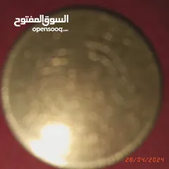  19 قطع نقدية قديمة تونسية وغير تونسية وساعة جيب ألمانية و مغارف سبولة ومفتاح قديم