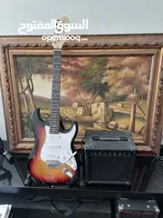  7 Fender electric guitar stratocaster replica with 10 watt amplifier.