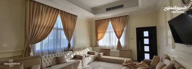  22 Quality House curtains and sofa