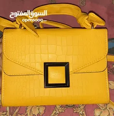  1 Yellow leather bag with brown linen interior