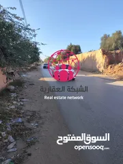  2 أرض سكنية تجارية ع الرئيسي شارع الشجر